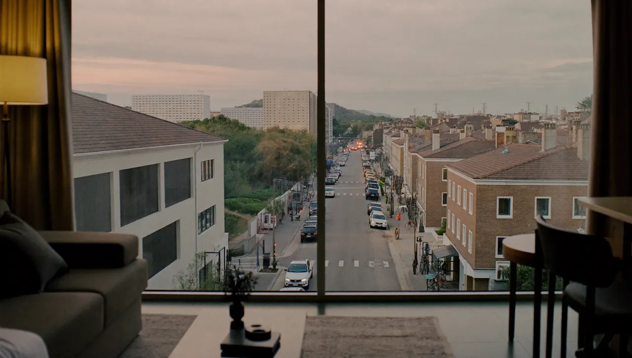 View through a window onto a busy street from a quiet interior room
