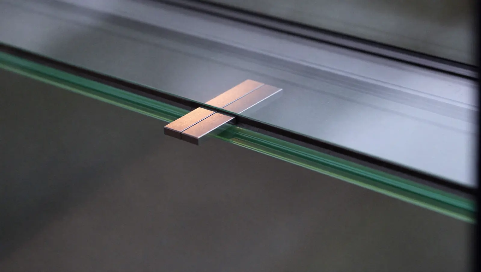 Close detail of a sealed double glazing unit edge and spacer bar